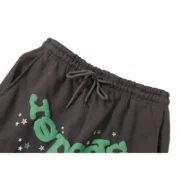 Close-up view of the Sp5der Wait Web Sweatpant in Slate-Green showing the elasticated drawstring waistband detail.