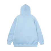 Back view of the premium unisex Sp5der Web Hoodie in a serene sky blue color, showcasing its relaxed, loose fit.