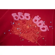 Close-up view of the Sp5der Worldwide Red Angel Number 555 hoodie, featuring the signature web and number graphic.
