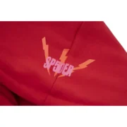 Close-up view of the Sp5der Worldwide Red Angel Number 555 hoodie logo design printed on premium bright red fabric.
