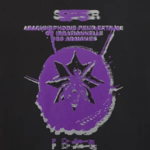 Close up of the Sp5der France Blur Tee featuring a prominent purple blurred spider graphic and French text on black cotton.