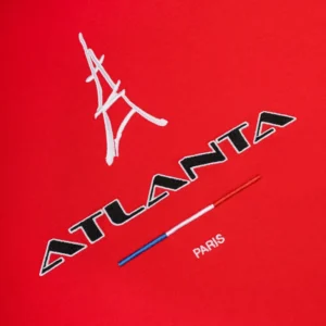 Close up of the Sp5der Araignée Tee showing the embroidered red fabric with Atlanta Paris and Eiffel Tower graphic