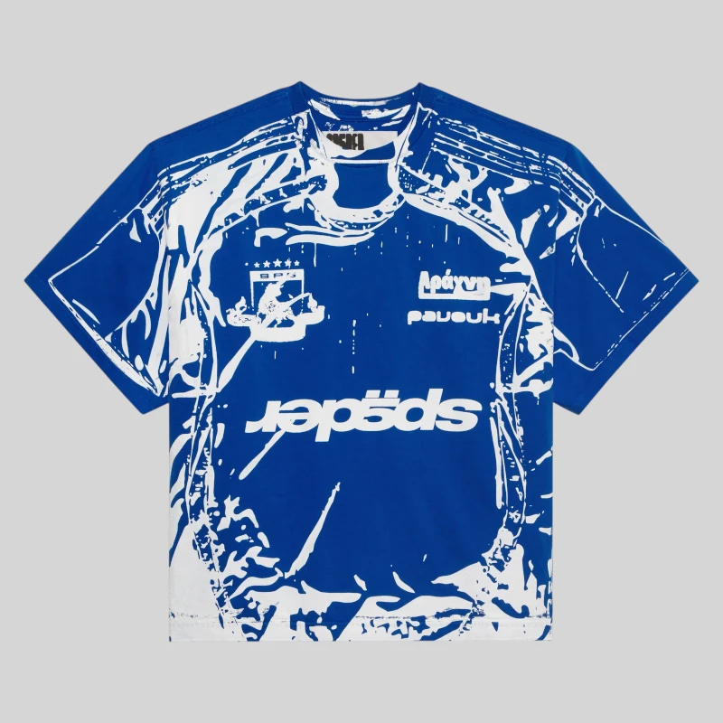 Front view of the blue and white Sp5der Jersey Overprint Tee featuring graphic branding and a stylish athletic design.