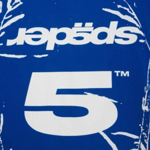 Detailed close-up view of the Sp5der Jersey Overprint Tee featuring bold white branding and graphic design on blue fabric.
