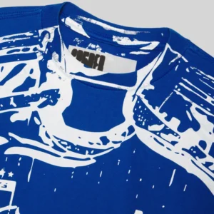Close up view of the blue and white Sp5der Jersey Overprint Tee showing the detailed neck area and graphic pattern