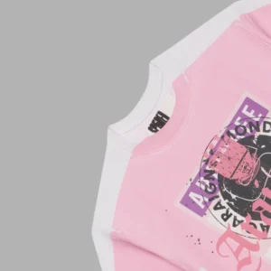 Close up view of the Sp5der Overprint Araignee Tee in a pink and white colorway featuring branded detailing