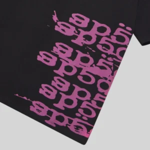 A close-up view of a black Sp5der Stacked T-shirt featuring repeated purple logo text across the fabric surface.