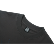 Close up view of the Sp5der Wait Web T-shirt showing the interior brand tag detail on the collar of the premium fabric.
