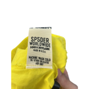 Sp5der OG Web Double Layer Short showing the authentic brand care label with fabric and washing instructions detail