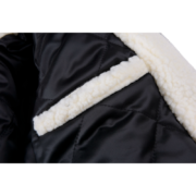Detailed close-up view of the interior lining of the Sp5der wor1dwide 555555 Hunters Sherpa Jacket, showing quilted fabric.