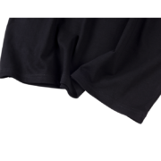 Close-up view of the premium cotton fabric texture used in the black Sp5der The Spot Tee streetwear garment.