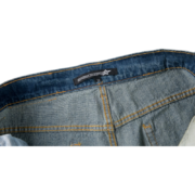 Close-up of the Sp5der 5Star Vintage 501 Denim inner waistband label showing the brand logo and signature branding detail.