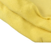 Close-up view of the premium yellow fabric texture on the Sp5der 5Star Hoodie, showcasing quality cotton construction.