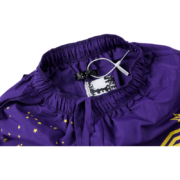 Close-up view of the interior tag and waistband detailing on the purple Sp5der SP5 Pro high-performance athletic shorts.