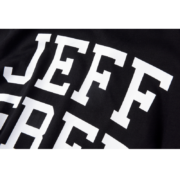 Close-up view of the SP5DER Jeff Free tee featuring bold white typography on a premium black cotton streetwear fabric.