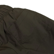 Close-up view of the detailed pocket on the Sp5der OG Web Double Layer Short in a dark olive colorway.