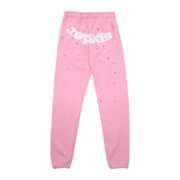Premium pink Sp5der Atlanta sweatpants featuring iconic white branding and a starry distressed design detail.