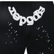 Front view of SP5DER Black OG Web Sweatpants featuring a bold white graphic print and iconic web-inspired star detailing.