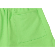A detailed look at the pocket on the vibrant green Sp5der Websuit sweatpants from our latest streetwear collection.