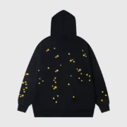 Back view of the black Sp5der Atlanta star-print hoodie featuring a fleece construction and unique yellow star graphics.