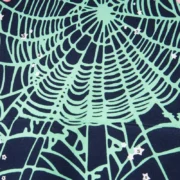Close up of the signature light green Sp5der web graphic print on the Navy Blue OG streetwear hoodie fabric.