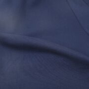 Close-up view of the premium blue fabric texture used for the Sp5der Arach NY Phobia streetwear sweatpants.