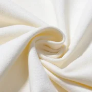 Detailed look at the soft, high-quality cream-colored fabric of the Sp5der x Mariah the Scientist Scorpion Hoodie.
