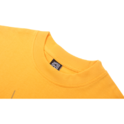 Closeup view of the vibrant yellow Sp5der Wait Web T-shirt featuring a detailed brand tag inside the ribbed collar.