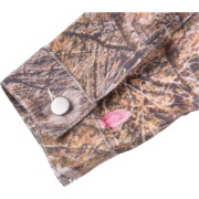 Close-up view of the Real Tree Camo sleeve detail on the Sp5der Trucker Jacket featuring a metallic button closure.