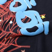 Sp5der 555 Young Thug T-shirt with bold blue puffed branding, red web patterns, and unique star graphics.