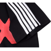 Close-up of the black Sp5der 5EX top featuring signature white side stripes and a bold red X graphic design element.