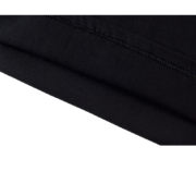 Close-up of the premium black cotton fabric and durable reinforced stitching on the SP5DER L'Araignee streetwear T-shirt.