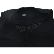Detailed view of the black Sp5der OG Tree Camo sweatpants showing the elastic waistband and premium fabric construction.