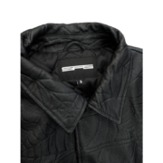 Close-up of the black SP5DER Debossed Web Studded Leather Jacket showcasing the interior branding and leather detail.