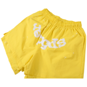 Sp5der OG Web Double Layer Shorts in bright yellow, featuring an iconic web graphic design for a stylish summer look.