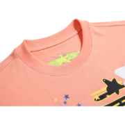 Close-up of the peach Sp5der Print t-shirt showing the inner neck label branding and the colorful graphic print details.