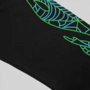 Close up detail of the black Juice WRLD 999 x Spider Worldwide 555 sweatpants featuring signature web graphic print.
