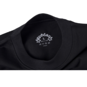 Close-up view of the inner neck label on a black SP5DER Pro LW performance streetwear t-shirt with size L marking.