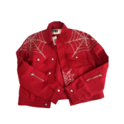 Front view of a red Sp5der denim jacket featuring detailed rhinestone web graphics and premium streetwear construction.