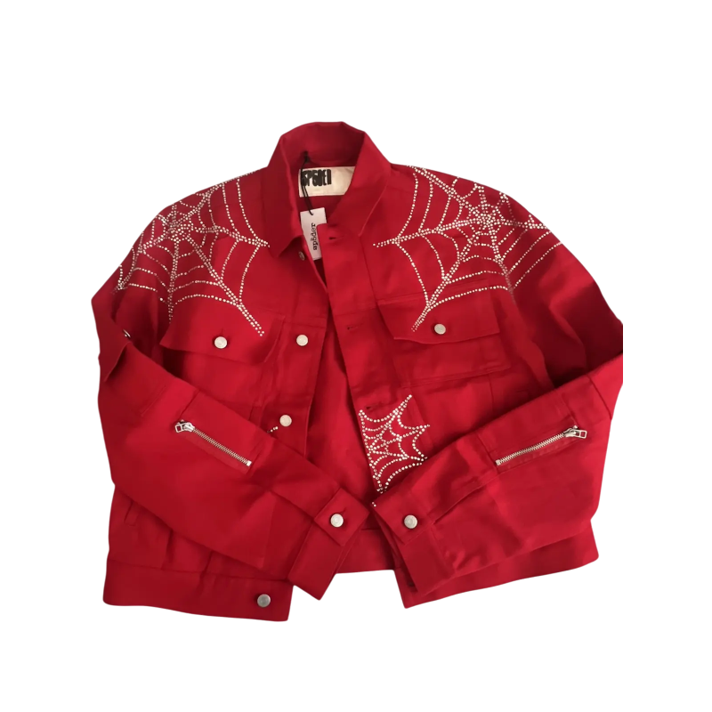 Front view of a red Sp5der denim jacket featuring detailed rhinestone web graphics and premium streetwear construction.