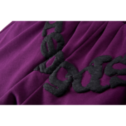 Close up of the Sp5der OG Web Logo sweat shorts in purple, featuring the signature black embroidered web design.