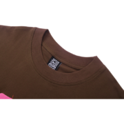 Close-up view of the collar and brand tag detail on the premium brown Sp5der Angel 555 t-shirt for streetwear fans.