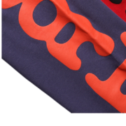 Close up view of the Sp5der Beluga Sweatpant in navy-blue showcasing the premium quality red graphic print detail.
