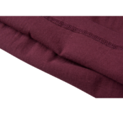 Close-up view of the premium fabric and reinforced stitching on the burgundy SP5DER WORLDWIDE 5EX streetwear tee shirt.