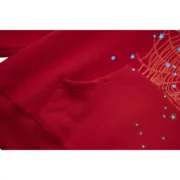 Close-up detail of the Sp5der Worldwide Red Angel Number 555 hoodie showing the vibrant red fabric and graphic design.
