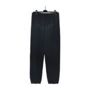 Black Sp5der OG Tree Camo sweatpants on a hanger, featuring a premium urban streetwear design and a relaxed fit.