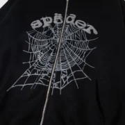 Sp5der Phantom Web zip-up hoodie in black with a prominent signature grey web graphic print and metal front zipper.