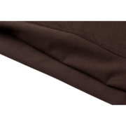 Close-up view of the premium quality brown cotton fabric used for the Sp5der 555 streetwear t-shirt collection.