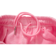 Close-up view of the elastic waistband and adjustable drawstring on the pink Sp5der Atlanta sweatpants.