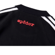 Black Sp5der 5EX top featuring iconic red brand logo detail on the back and minimalist striped sleeve accents.